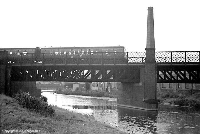 Passenger train to Nottingham, crossing the river Soar just north of Leicester Central station