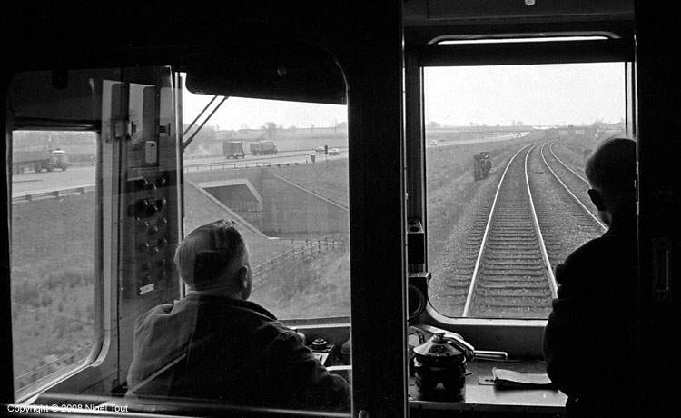 Train on ex-GCR alongside M1 motorway, north of Ashby Magna